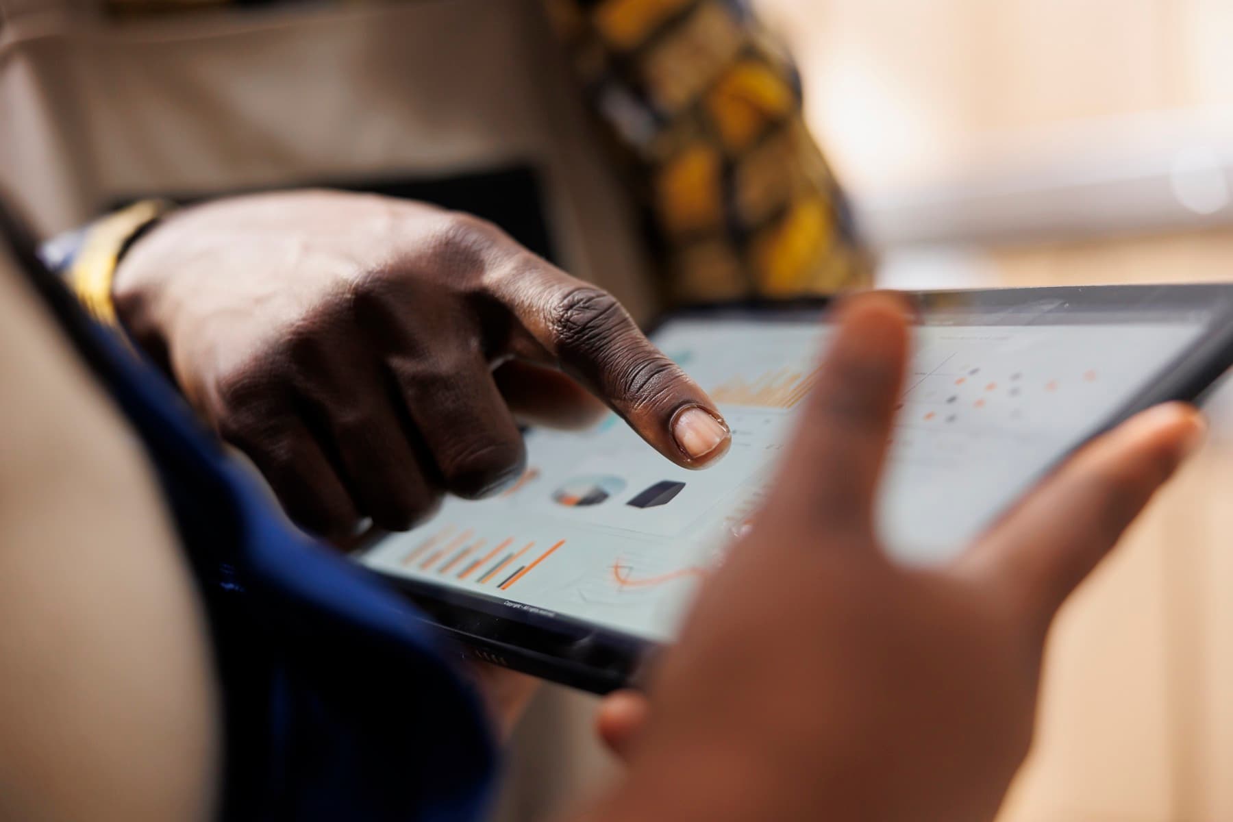 Warehouse worker reviewing inventory statistics on a tablet